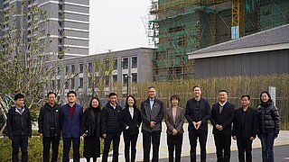 Group picture of the event participants in front of the pilot buiding